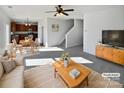Open living room, kitchen, and dining area with neutral colors at 113 Boiling Brook Dr, Statesville, NC 28625