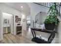Bright entryway features wood floors and a decorative console table at 18022 Stark Way, Charlotte, NC 28278
