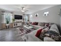 Spacious living room with modern decor, including a large sectional sofa at 18022 Stark Way, Charlotte, NC 28278