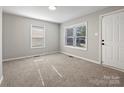 Bright bedroom with new carpet, neutral walls, and two windows at 350 Orr Dr, Rock Hill, SC 29730