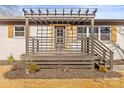 Charming front porch with pergola, wooden deck, and modern railings at 3722 Unionville Indian Trail W Rd, Indian Trail, NC 28079