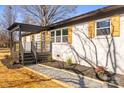 Landscaped side yard with gravel pathway, leading to a charming home at 3722 Unionville Indian Trail W Rd, Indian Trail, NC 28079