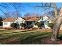 Ranch home with landscaped lawn and mature trees at 5360 Creekwood Dr, Salisbury, NC 28147