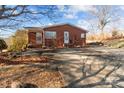 Brick ranch house with a spacious yard and driveway at 700 Snuggs St, Albemarle, NC 28001