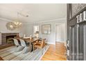 Bright dining room featuring hardwood floors and a wood dining table at 741 Mcalway Rd, Charlotte, NC 28211