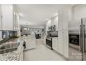 Modern kitchen with white cabinets, granite countertops, and stainless steel appliances at 741 Mcalway Rd, Charlotte, NC 28211