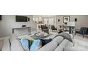Open concept living room with comfortable seating and a view into the kitchen at 741 Mcalway Rd, Charlotte, NC 28211