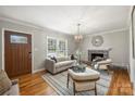 Bright living room showcasing hardwood floors, a fireplace, and an abundance of natural light at 741 Mcalway Rd, Charlotte, NC 28211