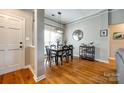 Dining room features hardwood floors and modern light fixture at 814 Water Wheel Ct, Charlotte, NC 28209