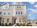 Three-story townhome with brick and siding exterior, showcasing a charming front entrance at 8300 Waxhaw Hwy Hwy # 103, Waxhaw, NC 28173