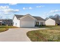 View of the home's side elevation and driveway at 120 Elmwood Rd, Statesville, NC 28625