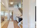 Bright entryway with hardwood floors and staircase at 2026 Thatcher Way, Fort Mill, SC 29715