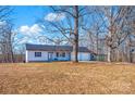 Country home with a spacious yard and a basketball hoop at 343 Cranfill Rd, Harmony, NC 28634