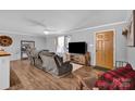 Cozy living room featuring hardwood floors and a fireplace at 343 Cranfill Rd, Harmony, NC 28634