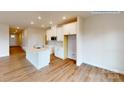 Modern kitchen with white cabinets, quartz countertops, and an island at 600 Banter Ln # 27, Cramerton, NC 28032