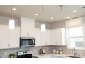 Modern kitchen with white shaker cabinets, recessed lighting, and subway tile backsplash at 7232 Hodges Meadow Ln, Charlotte, NC 28213