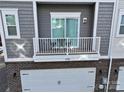 Private balcony with table and chairs at 1028 Sharon Towns Dr, Charlotte, NC 28210