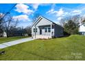 House exterior with gray siding and a lawn at 1077 Gibson St, Albemarle, NC 28001