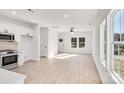 Bright living room with kitchen, wood floors and lots of natural light at 1077 Gibson St, Albemarle, NC 28001