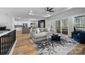 Open living room with gray sectional sofa and kitchen views at 115 Brentwood Dr, Maiden, NC 28650