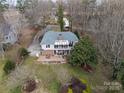 Expansive aerial shot showing a mature landscaped yard, deck and patio area at 124 Muirfield Dr, Kings Mountain, NC 28086