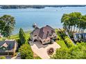 Luxury waterfront home with expansive lake views and private dock at 132 Rollingwood Ln, Mooresville, NC 28117