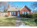 Brick house with a gray roof, walkway, and landscaping at 168 Park St, Statesville, NC 28677