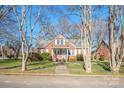 Brick house with a gray roof, walkway, and landscaping at 168 Park St, Statesville, NC 28677