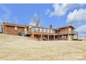 Back of house with a large deck and covered patio area at 2448 Moss Farm Rd, Hickory, NC 28602