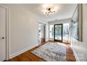 Bright entryway with hardwood floors and large art piece at 2861 Sharon Rd, Charlotte, NC 28211