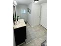 Clean bathroom with dark vanity and tile flooring at 507 E Third Ave, Gastonia, NC 28054