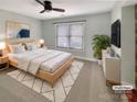 Light and airy main bedroom with a large window and plenty of space at 6308 Latta Springs Cir, Huntersville, NC 28078