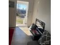 Inviting entryway with hardwood floors, open door, and a view of the neighborhood at 640 Mckee St, Albemarle, NC 28001