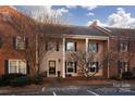 Brick front exterior of a charming two story home with landscaping at 6742 Constitution Ln, Charlotte, NC 28210