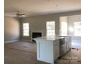 Spacious living room with fireplace and open concept kitchen at 785 Seipel Dr, Denver, NC 28037