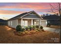 Charming one-story home with solar panels and landscaped yard at 8932 Pennegrove Cir, Charlotte, NC 28214