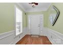 Bright entryway with hardwood floors and plantation shutters at 9021 Gander Dr, Charlotte, NC 28277