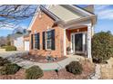 Front entrance of brick and siding ranch home with landscaping at 9021 Gander Dr, Charlotte, NC 28277