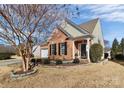 Brick and siding ranch home with landscaping and walkway at 9021 Gander Dr, Charlotte, NC 28277