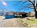 Brick home with spacious backyard, detached garage, and shed at 947 Ravendale Dr, Charlotte, NC 28216