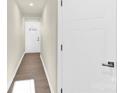 Light and bright hallway with wood-look flooring at 9951 Violets Dream Nw St, Huntersville, NC 28078