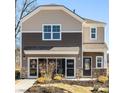 Two story home with neutral siding and a large two car garage at 14517 Winged Teal Rd, Charlotte, NC 28278