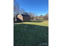 Large backyard with storage shed and open green space at 2805 N Main St, Kannapolis, NC 28081