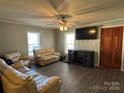 Bright living room featuring light beige couches and a large TV at 2805 N Main St, Kannapolis, NC 28081