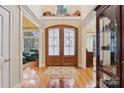 Two-story foyer with double doors and hardwood floors at 7282 James Ct, Denver, NC 28037