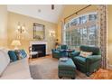 Sitting room with fireplace and large windows at 7282 James Ct, Denver, NC 28037