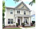 Attractive home with a covered porch, showcasing a well-maintained exterior and a desirable location at 9415 Rosalyn Glen Rd, Cornelius, NC 28031