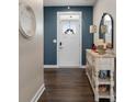 Entryway with dark hardwood floors and a console table at 10225 Black Locust Ln, Charlotte, NC 28215