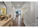 Bright and spacious entryway with hardwood floors and a view to the living room at 10225 Black Locust Ln, Charlotte, NC 28215