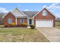 Brick ranch house with attached garage and manicured lawn at 104 Brookview Dr, Shelby, NC 28152